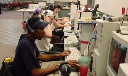 A row of young people sitting at computers