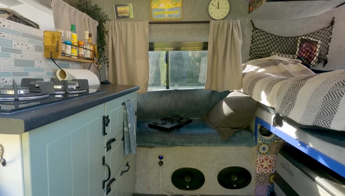 The van includes a little kitchen and awesome speaker system