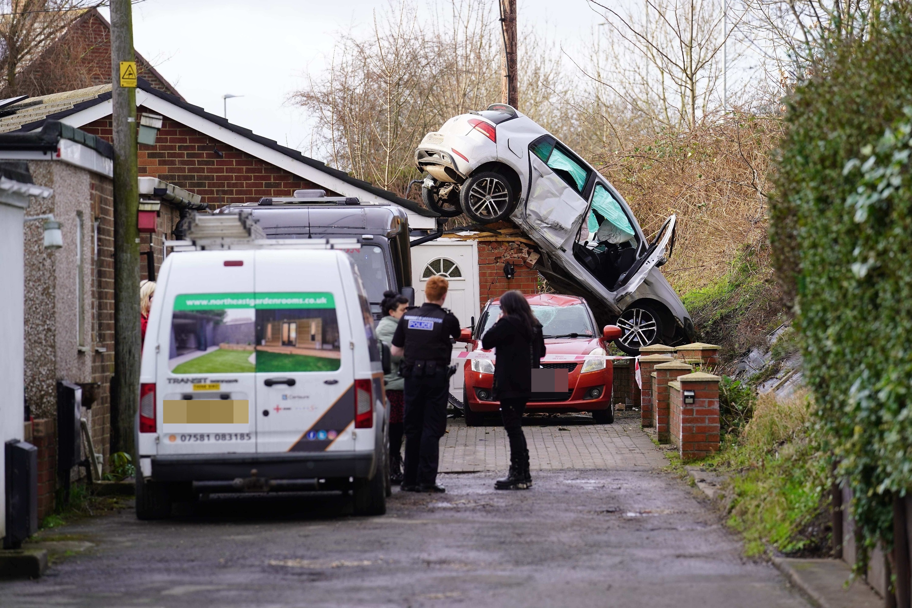 Cleveland police, fire and ambulance attended the scene in Stockton where a car was forced off the road and onto a roof at around 10.20am yesterday