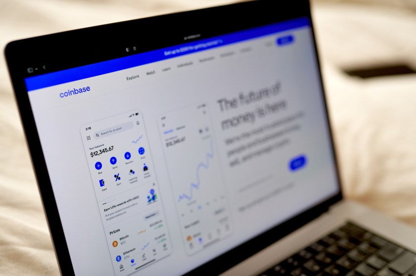 Coinbase website homepage displayed on a laptop