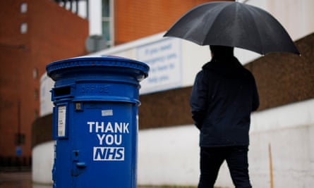 The NHS sign with a ‘Thank You’ note on a post box outside St Thomas’ hospital in London, December 2023.