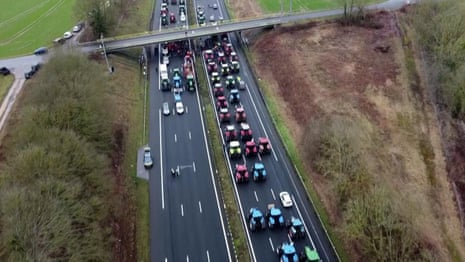 Farmers block motorway near Paris in wave of nationwide protests – video