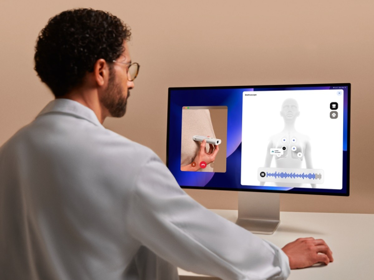 Using the stethoscope during a remote doctor's visit.