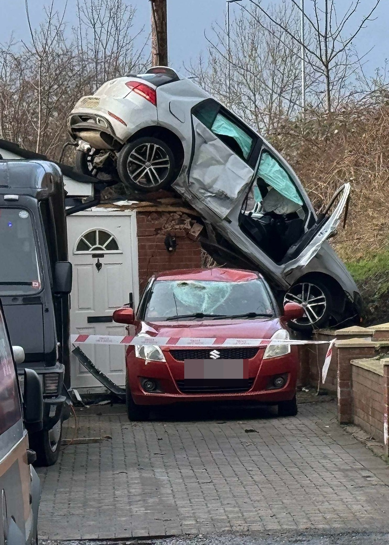 A woman was left feeling under par this morning as a Volkswagen Golf landed on her garage roof