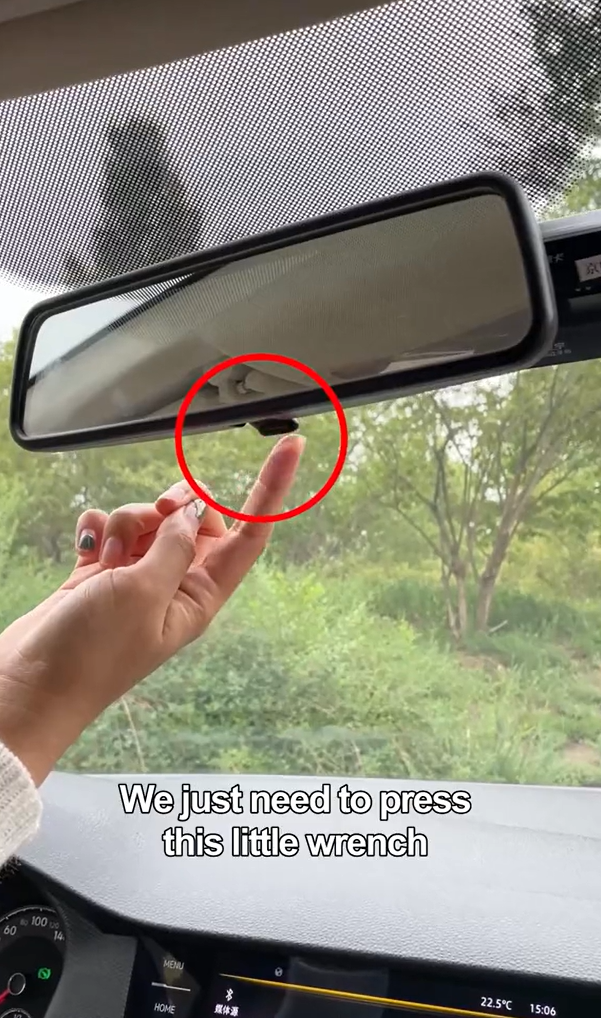 By flicking the tab, the mirror's angle will change and prevent glare