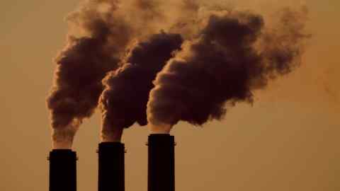 Emissions rise from the smokestacks at a coal power plant