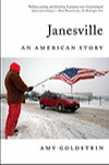 A book jacket for Janesville by Amy Goldstein. It has a man wearing red trousers and a red hat on the standing in the snow waving a US flag in front of a red car