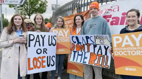 PA Media Junior doctors on the picket line in Belfast in May 2024