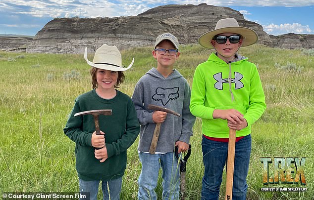 Liam Fisher (left), Kaiden Madsen (middle), and Jessin Fisher (right) discovered an extremely rare teenage T-rex fossil in the Hell Creek badlands of North Dakota