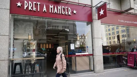 PA A person walks past a Pret a Manger in London