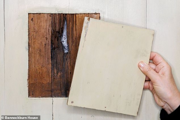 Amidst the delicate plaster work and ancient wooden panelling, a musket ball hole (pictured) has been discovered - evidence of the assassination attempt, experts say