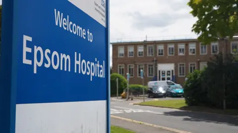 Signpost for Epsom Hospital outside the building