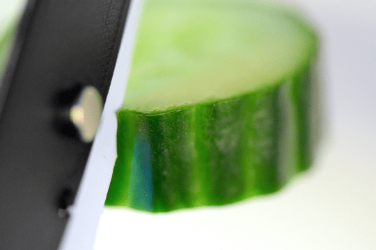 The Papermachete slicing through cucumber 