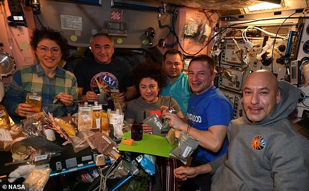 At 7:30 pm the crew come together for a dinner. The astronauts need to eat 2,500 calories a day so dinner is usually a three-course meal with lots of options to choose from. On special occasions such as Thanksgiving (pictured) the crew come together for a big group meal. Pictured: (from left to right) NASA astronaut Christina H. Koch , Aleksandr A. Skvortsov of Roscosmos, NASA astronaut Jessica U. Meir, Oleg I. Skripochka of Roscosmos, NASA astronaut Andrew R. Morgan, and Luca S. Parmitano of the European Space Agency