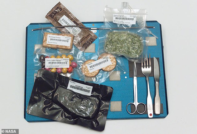 Astronauts' food arrives in sealed packs to help it last longer. Water is added through a valve and the packs are cut open. When the food is wet it sticks to itself so there is no risk of dinner floating away