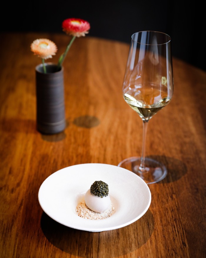 A bowl of red-pea ice cream, caramelised white chocolate and caviar, paired with Tsuchida Koji 99 sake at Ikoyi