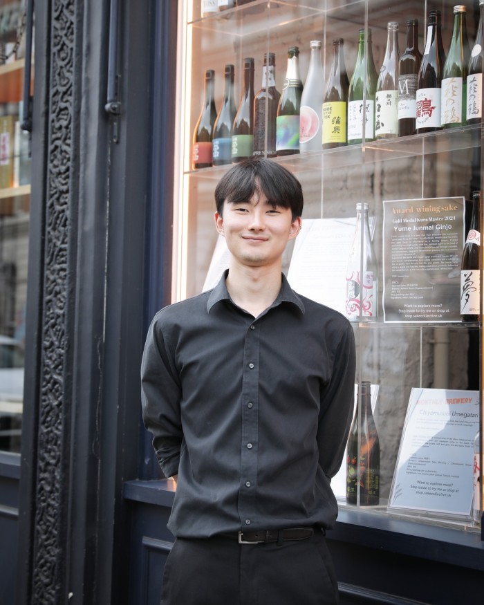 Satoshi Hirasaki of east London’s Sake Collective standing in front of the store 