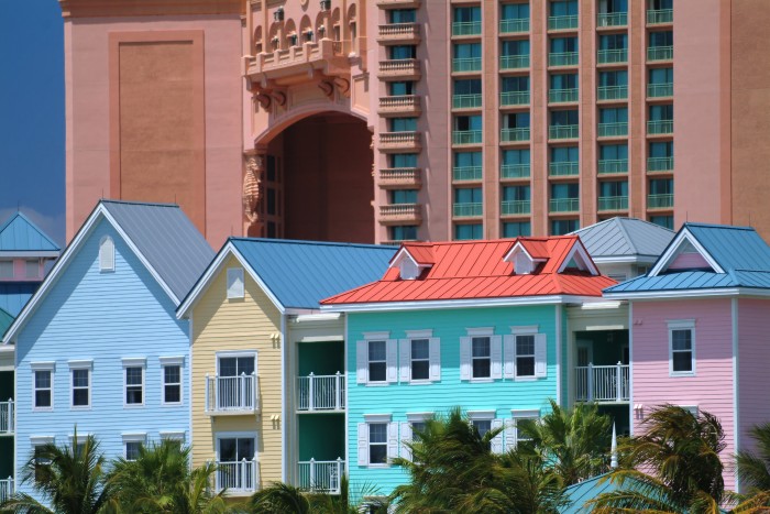 rows of colourful townhouses against a luxurious resort