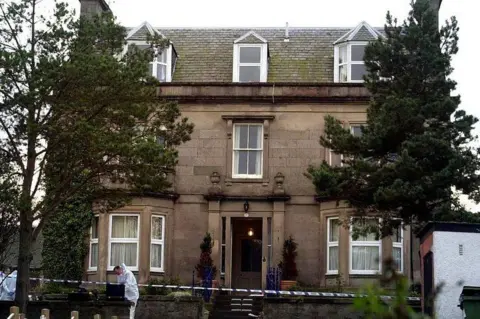 Forensic officers at the Wilsons' home in Nairn