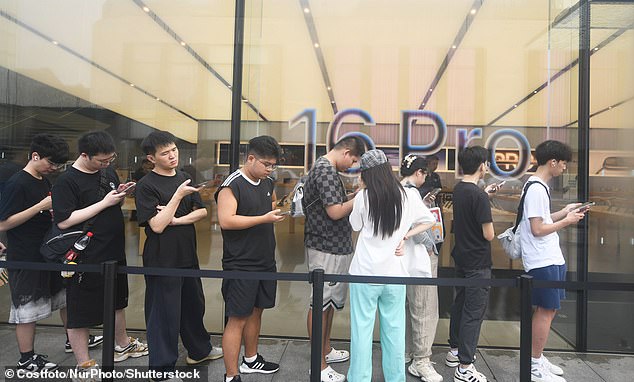 HANGZHOU, CHINA: The excitement is almost palpable as Chinese smartphone owners line-up to buy... another smartphone