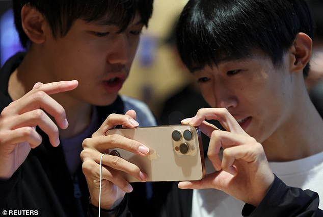 BEIJING, CHINA: Enthusiastic customers in Beijing try the iPhone 16 Pro earlier on Friday. All four iPhone 16 variants are now available to buy