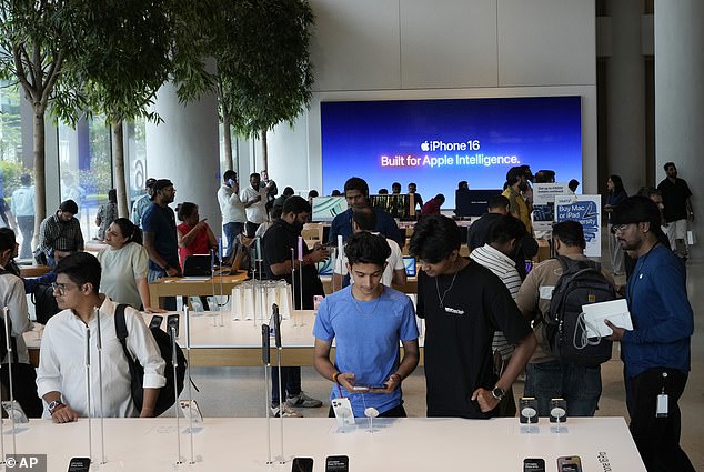 MUMBAI, INDIA: Customers look around during the first day of the iPhone 16 smartphone sales