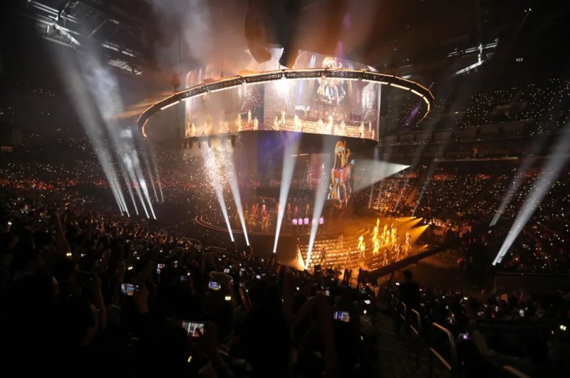 Flames and searchlights at the League of Legends Worlds Championship.