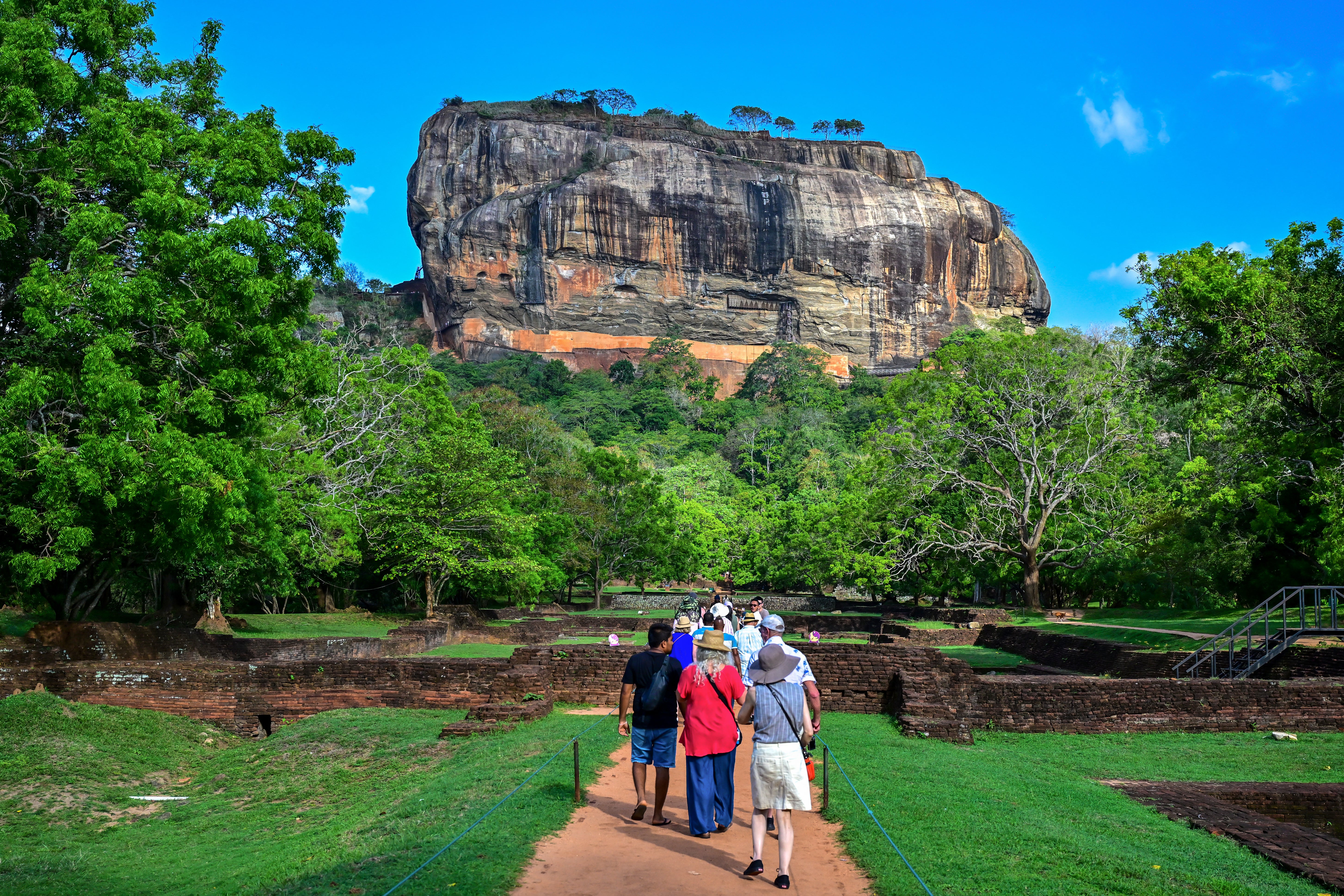 Tourists visit the ancient rock fortress in Sigiriya on October 16, 2024