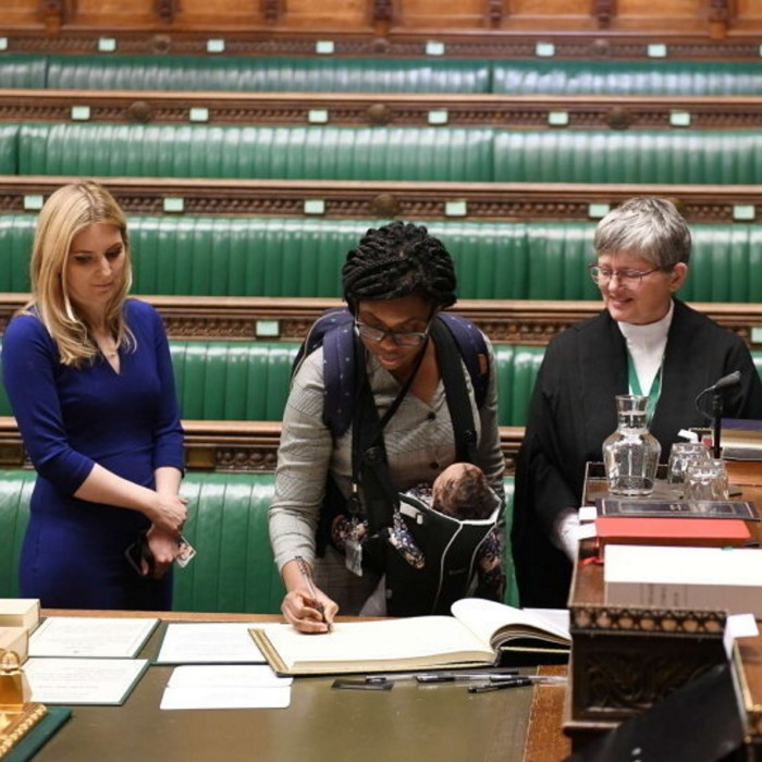 Kemi Badenoch signs a ledger