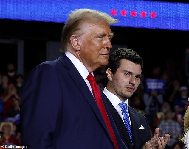 Mr Trump, pictured in Grand Rapids, Michigan, held four rallies on Monday, Election Day Eve. His rally in Michigan began at 10:30 pm