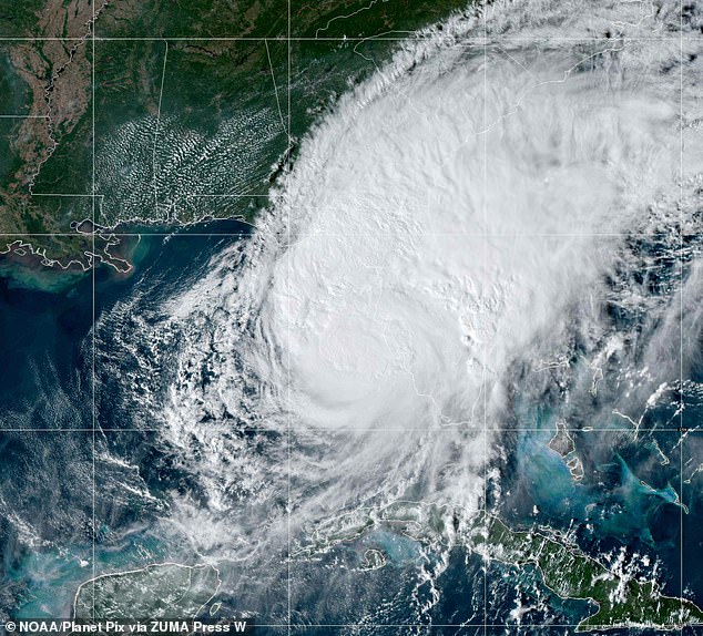 Smartphones generate 580 million tons of carbon dioxide annually. These emissions warm Earth's oceans, fostering conditions for storms such as Hurricane Milton , a Category 3 storm that struck Florida in October (pictured)