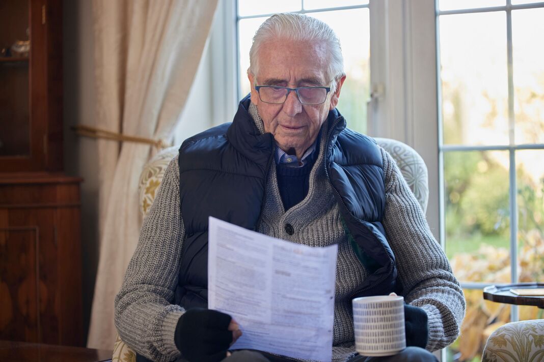 Man looking at energy bill