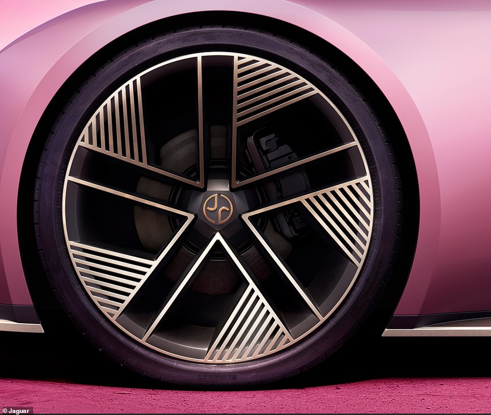 Riding on these vast 23-inch wheels and painted in a dramatic and ¿exuberant¿ satin shade called ¿Miami Pink¿, familiar Jaguar branding is now absent and replaced with new badges revealed last month as part of its plans to start from fresh as an exclusive EV maker, effectively turning a corner on its century-long heritage