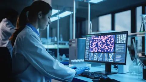 Getty Images Female researcher works on a screen