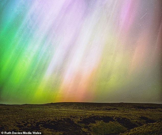 Most of the CMEs over the last 24 hours have been considered far-sided, meaning they won't strike Earth. However, astronomers have discovered one heading our way which could spark Northern Lights just in time for New Year's Eve. Pictured: Northern Lights seen in Wales in May