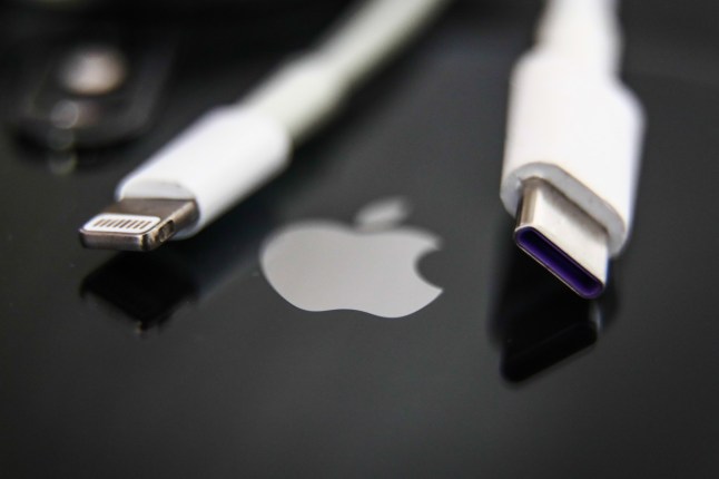 Lightning and USB-C cables are seen with Apple iPhone in this illustration photo taken in Krakow, Poland on September 25, 2021. (Photo by Jakub Porzycki/NurPhoto via Getty Images)