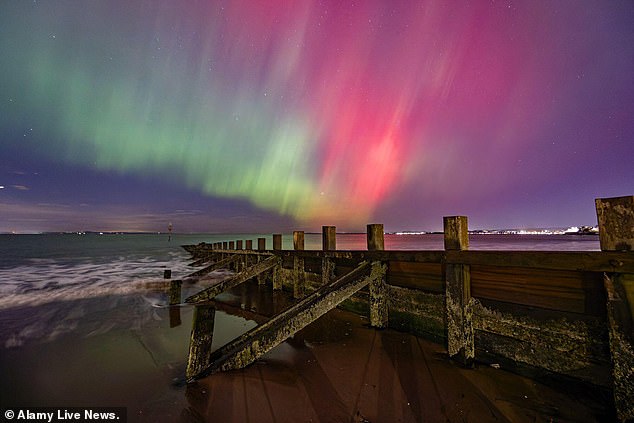 The Northern Lights will be visible across huge parts of the UK tonight, the Met Office has revealed. Pictured: The Northern Lights over Portobello, near Edinburgh, in October