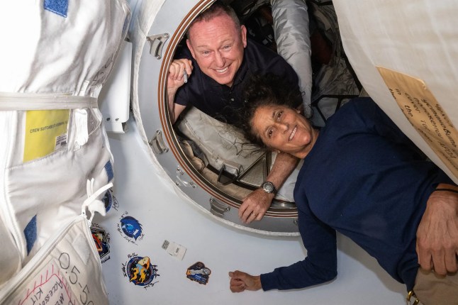 (FILES) This undated handout picture from Nasa released on July 2, 2024 shows NASA's Boeing Crew Flight Test astronauts (from top) Butch Wilmore and Suni Williams inside the vestibule between the forward port on the International Space Station's Harmony module and Boeing's Starliner spacecraft. Two astronauts stranded in space may sound like the start to a big-screen science thriller, but the Boeing Starliner mission is no work of Hollywood fiction. Astronauts Barry "Butch" Wilmore and Sunita "Suni" Williams were originally scheduled to spend a little more than a week aboard the International Space Station as part of the debut crew flight test of the Starliner. However, the spacecraft encountered several issues during the flight, and now the two astronauts will likely have to extend their stay aboard the ISS for several months. (Photo by Handout / NASA / AFP) / RESTRICTED TO EDITORIAL USE - MANDATORY CREDIT "AFP PHOTO / NASA" - NO MARKETING NO ADVERTISING CAMPAIGNS - DISTRIBUTED AS A SERVICE TO CLIENTS (Photo by HANDOUT/NASA/AFP via Getty Images)