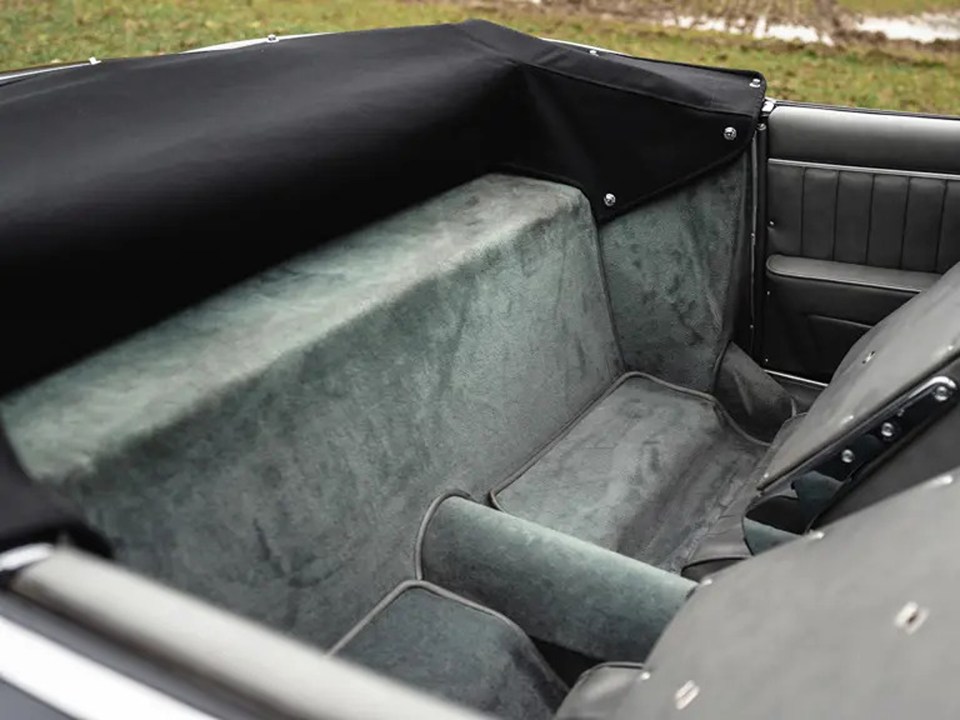 The interior boasts grey suede seats