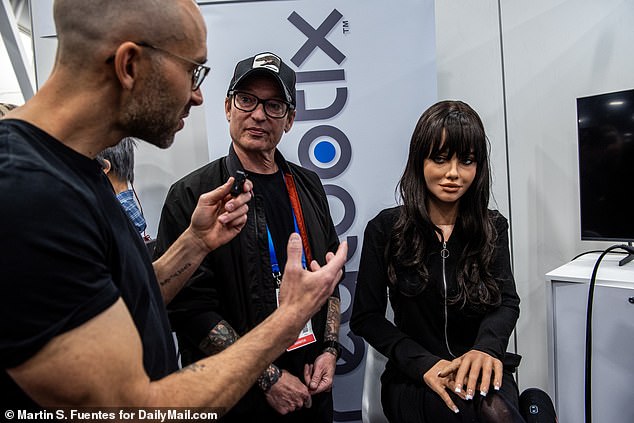 The above shows the robot Melody (far right) with the founder Martin McMullen (center). Melody is a seated version of the robot